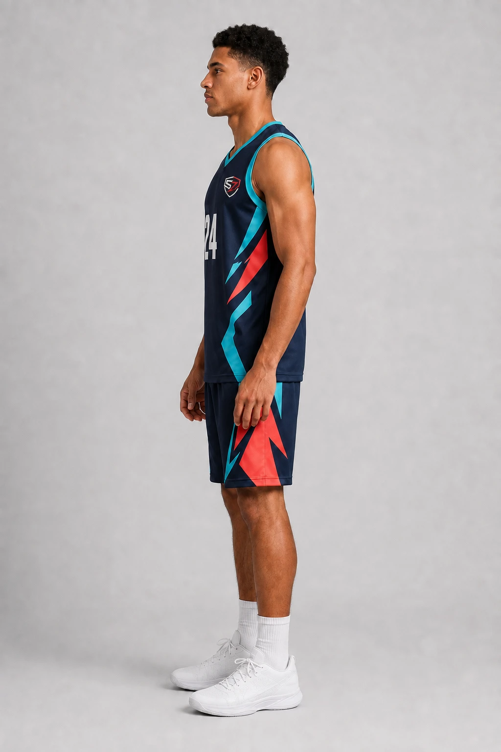Side profile of a custom sublimated basketball uniform showing coordinated jersey and shorts graphics