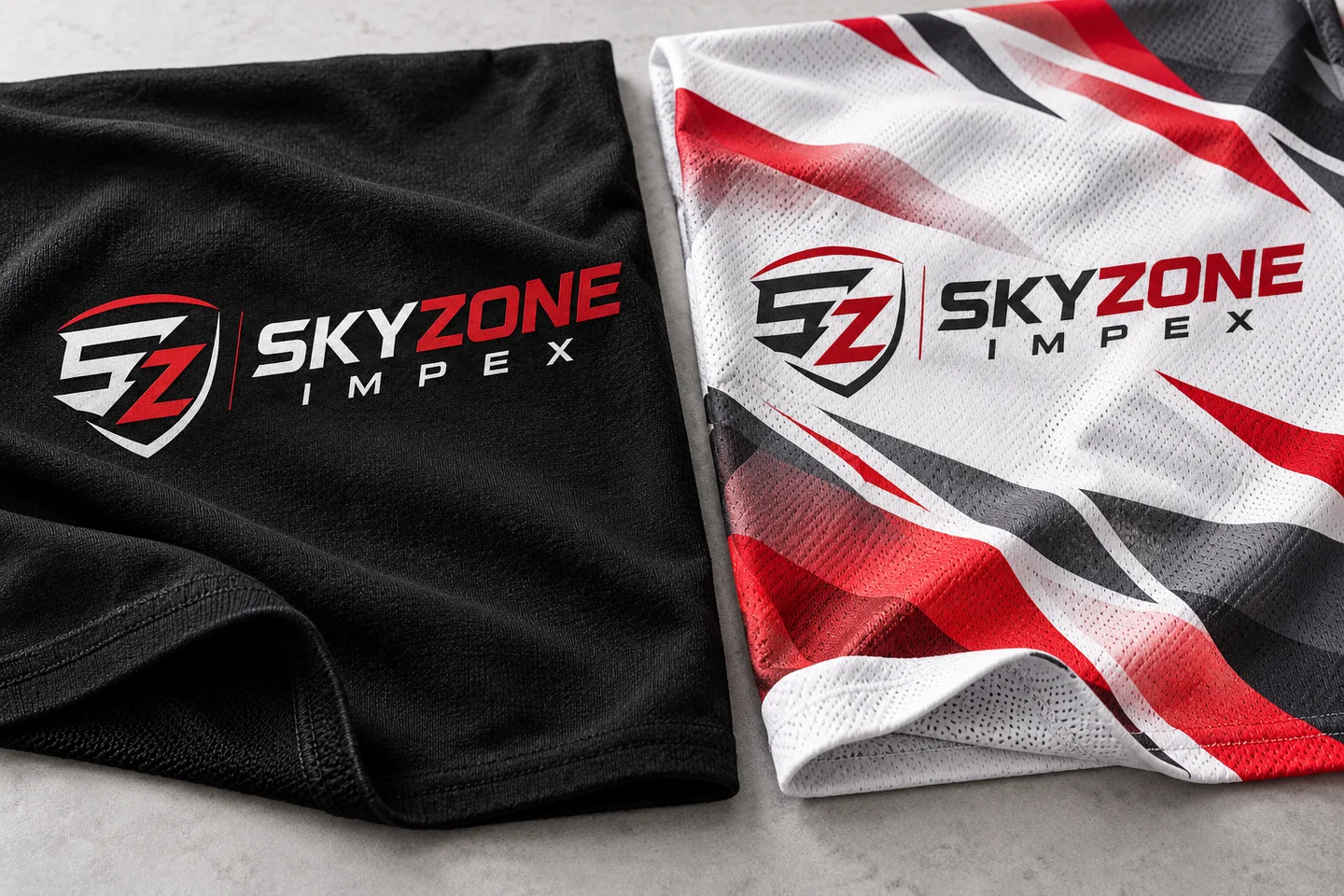 Skyzone branded fabric samples illustrating a solid logo print and an all-over sportswear design